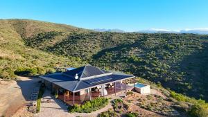 an overhead view of a house with a blue roof at Eldorado TopHouse in McGregor +25 photos