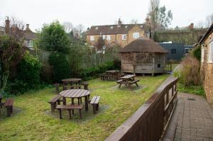 a group of picnic tables and a gazebo at Mason's Arms in Montacute