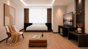 a bedroom with a bed and a tv and a chair at 云涧江景酒店-重庆解放碑店 Chongqing Yunjian High-altitude River View Hotel-Jiefangbei Hongyadon in Chongqing