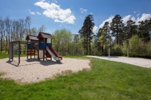 a playground with a slide in a park at Scandic Sørlandet in Kristiansand