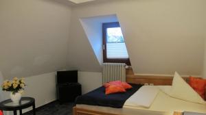 Postel nebo postele na pokoji v ubytování Hotel Anlage Heidelberg