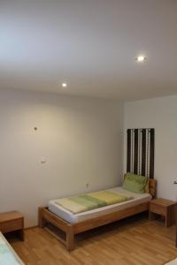 Postel nebo postele na pokoji v ubytování B&B Wolfsberg