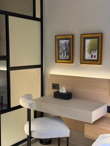 a room with a white desk and a chair at Local Sursock in Beirut