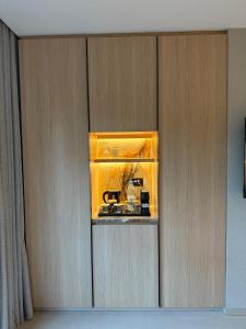 a cupboard with a kitchen in a room at Local Sursock in Beirut
