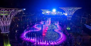 an aerial view of a fountain at night at The Pathway Condotel in Sầm Sơn
