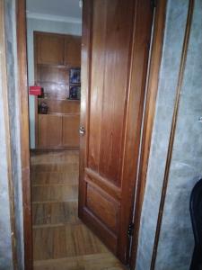 a wooden door in a room with a wooden floor at Lalo in Tbilisi City +10 photos