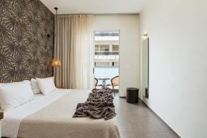 a hotel room with a bed and a desk at Atlantis Boutique City Hotel in Rhodes Town +79 photos