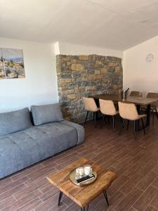 a living room with a couch and a table at Apartment Panger in Izola