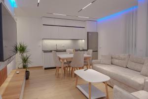 a living room with a couch and a table at Seaview Premium Apartment in Durrës