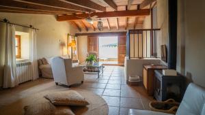 a living room with a couch and a table at Agroturisme Son Cardaix in Artá
