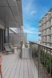 a balcony with a view of the ocean at Aposentus - Sal D 'Ouro Exclusive in Canidelo