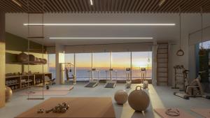 a room with a gym with a view of the ocean at Aposentus - Sal D 'Ouro Exclusive in Canidelo
