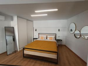 a bedroom with a large bed in a room at Alkaiou Loft in Kalamata