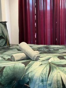 a pair of towels sitting on top of a bed at Beautiful Apartment in Mönchengladbach mit Wintergarten in Mönchengladbach