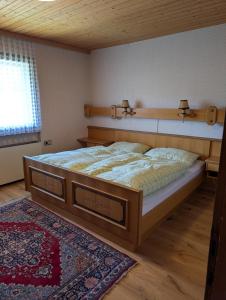 a bedroom with a large bed in a room at Ferienhaus Buchen in Schwarzenberg