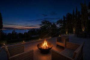 a fire pit on a patio at night at Bayview Luxe Retreat in Tascott