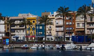 a group of boats docked in a harbor with buildings at Tarragona Rooms 4 in Tarragona