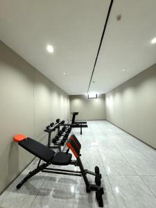 a gym with several tread machines in a room at Bishkek Crystal Luxury Smart Hotel Ala-Too Square Branch in Bishkek
