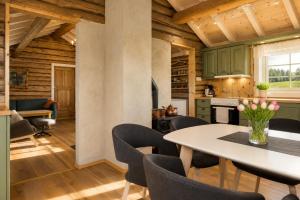 a kitchen and dining room with a table and chairs at Unique mountain retreat in Gol in Gol +8 photos
