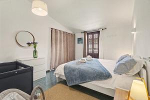 a bedroom with a bed and a mirror at Private Pool And Ocean Views in Chayofa +25 photos