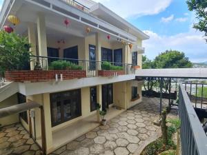a view of a house with a balcony at SugarHouse in Da Thanh