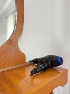 a black pen sitting on top of a wooden table at AS Orikum 1 in Orikum