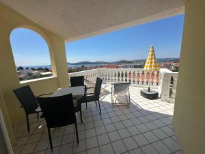 a view of a balcony with a table and chairs at Apartments Jareb in Tribunj