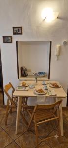 a table with plates of food on top of it at La Corte di mezzo in Corigliano dʼOtranto