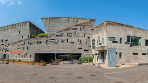 a large brick building with at Hotel Indigo Ningbo by IHG in Ningbo