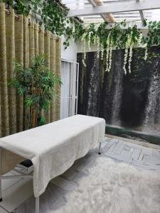 a table in a room with a waterfall at Sbukosezwe guest house in Johannesburg
