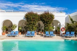 a resort with chairs and a swimming pool at The Marine Hermanus in Hermanus