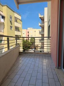 a balcony with a view of some buildings at AS Orikum 1 in Orikum