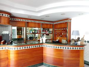 a bar in a room with wooden walls and floors at Albergo La Maria in Fiumaretta di Ameglia +20 photos