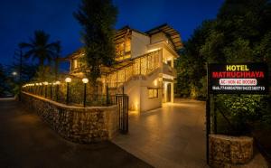 a hotel with a sign in front of a building at Hotel Matruchhaya Lonavala - Premium Quality and comfort in Lonavala