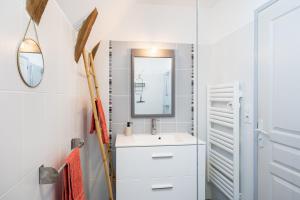 a bathroom with a sink and a mirror at Gite Le Ginestou in Almon-les-Junies +22 photos