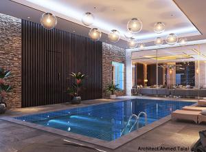 a large swimming pool in a building with at الحياة للشقق الفندقية in Jeddah