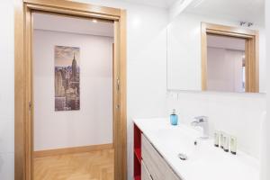 a bathroom with a sink and a mirror at Ardantza Bidea - baskeyrentals in Zumaia +49 photos