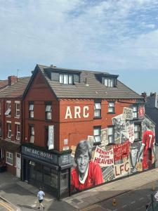 a building with a painting of a man on it at The Arc Hotel in Liverpool