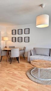 a living room with a couch and a table at AMAO-Sienna - Walk to Europa-Park - Terrace - 6 Guests in Rust
