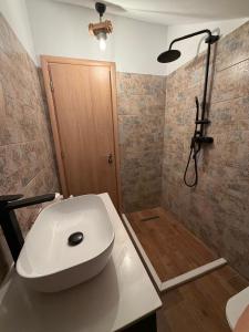 a bathroom with a toilet and a shower at Blue Eye Villas in Sarandë