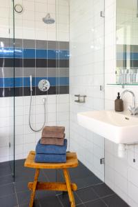 a bathroom with a sink and a shower at ParelDuyn in Oostkapelle +111 photos