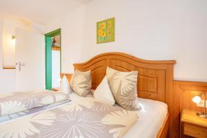 a bedroom with two beds with pillows on them at Steffi's Landhof in Bad Wörishofen