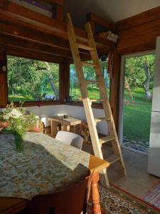 a room with a wooden ladder in a house at Bungalow Maria&Razvan in Pângărăcior +73 photos