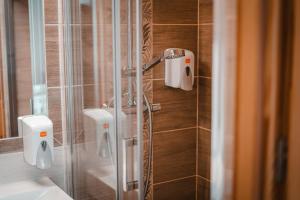 a shower in a bathroom with a glass door at U Hani in Bańska Wyżna +47 photos