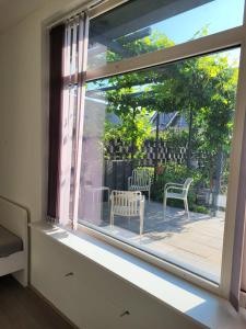 a window with a view of a patio at Plekkenpolhof in Enschede
