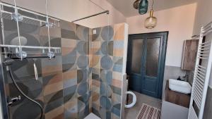 a bathroom with a shower and a sink at Casa Tatta - Luino centro in Luino