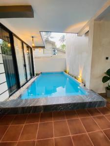 a swimming pool in the middle of a house at Sky Haven in Matara