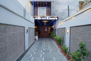 a hallway of a hotel with a hotel kaza sign at Hotel Kiaara in Varanasi