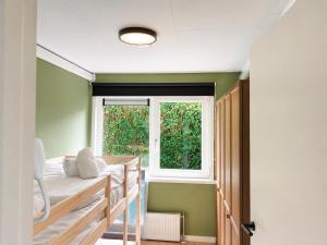 a room with two bunk beds and a window at Steam & Dream - Hottub & Sauna Retreat - Free WiFi - Full Privacy - Luxury Experience in Heinkensand +58 photos