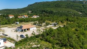 an aerial view of a house on a hill at Vela Stina Mobile home in Roč +21 photos